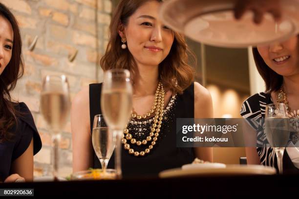 women waiting for food to be serviced. - companies hold welcome ceremonies across japan stock pictures, royalty-free photos & images