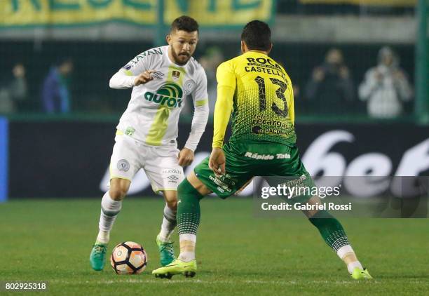Arthur Caike of Chapecoense fights for the ball with Gonzalo Pablo Castellani of Defensa y Justicia during a first leg match between Defensa y...