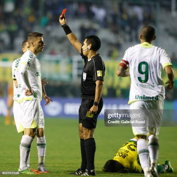 Referee Diego Haro shows a red card to Andrei Girotto of Chapecoense during a first leg match between Defensa y Justicia and Chapecoense as part of...