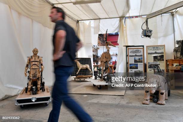 Artistic director of the company "La Machine" Francois Delaroziere walks, on June 20 in the Machine workshop in the nave of "Les Machines de L'Ile"...