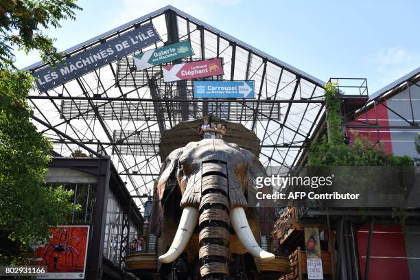 Picture taken on June 20, 20107 shows a mechanical elephant made of wood and steel walking at the Machine Gallery of "Les Machines de L'Ile" in...