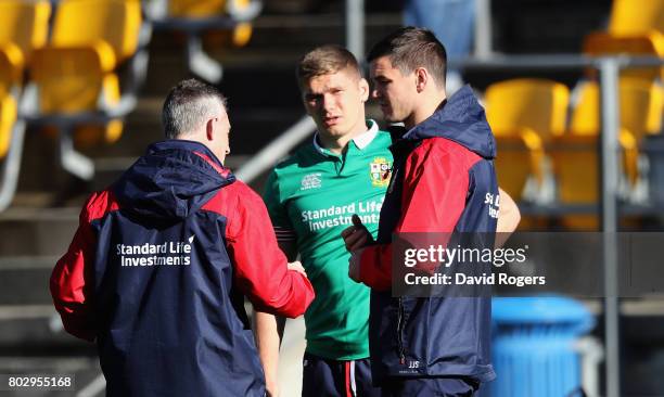 Rob Howley, the Lions backs coach talks to Owen Farrell and Jonathan Sexton during the British & Irish Lions training session at Porirua Park on June...