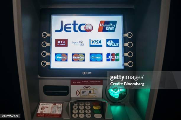 An automated teller machine equipped with facial-recognition software stands at a bank branch in Macau, China, on Wednesday, May 17, 2017. Chinese...