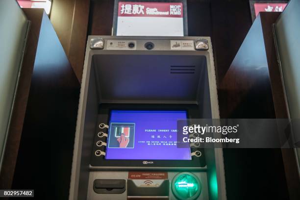 An automated teller machine equipped with facial-recognition software stands at a bank branch in Macau, China, on Wednesday, May 17, 2017. Chinese...