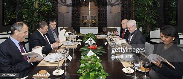 Top officials, counterclockwise from right, Defense Secretary Robert Gates, Secretary of State Condoleezza Rice meet their Russian counterparts,...