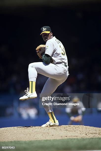 Pitcher Dave Stewart of the Oakland A's throws a pitch during a game on May 3, 1988 against the Detroit Tigers at Tiger Stadium in Detroit, Michigan....