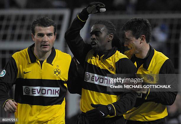 Dortmund's Brazilian midfielder Tinga celebrates scoring with his Swiss teammate Alexander Frei and Serbian defender Antonio Rukavina during the...