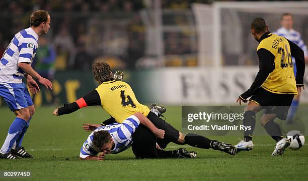 Christian Woerns of Dortmund fouls Marcel Schied of Jena during the DFB Cup semi final match between Borussia Dortmund and Carl Zeiss Jena at the...