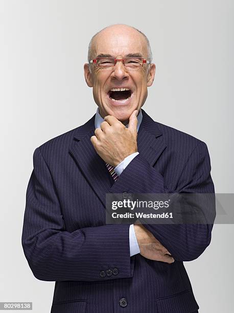 businessman, hand on chin, mouth open, portrait - angry bald screaming man ストックフォトと画像