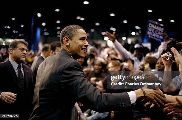 Democratic presidential candidate Sen. Barack Obama of Illinois and his wife Michelle greet supporters at a rally on the eve of the Texas...