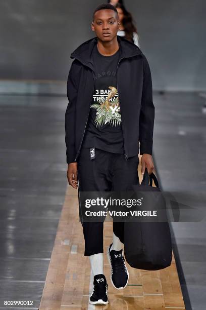 Model walks the runway during the Y3 Menswear Spring/Summer 2018 show as part of Paris Fashion Week on June 25, 2017 in Paris, France.