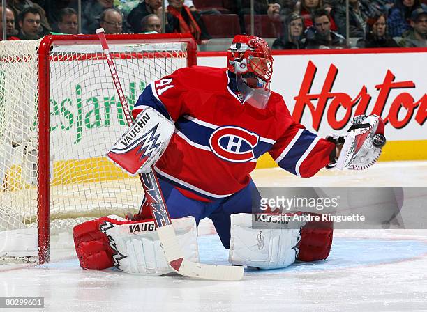 Jaroslav Halak of the Montreal Canadiens makes a glove save against the St. Louis Blues at the Bell Centre on March 18, 2008 in Montreal, Quebec,...