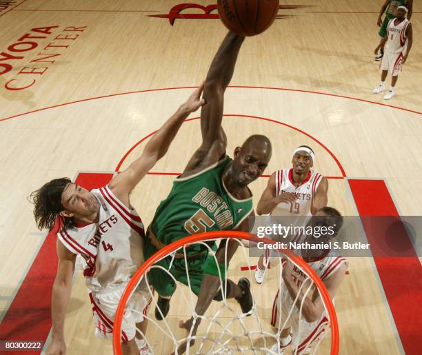 Kevin Garnett of the Boston Celtics goes for the dunk against Luis Scola and Steve Novak of the Houston Rockets on March 18, 2008 at the Toyota...