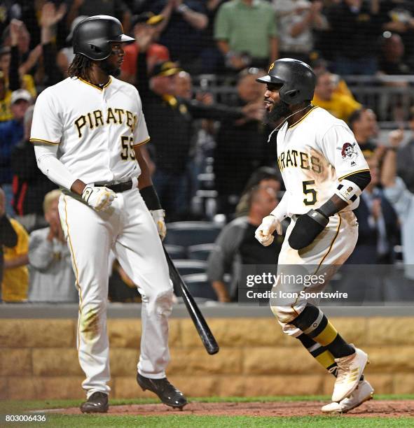 Pittsburgh Pirates second baseman Josh Harrison reacts as he comes around to score on a two run RBI double by Pittsburgh Pirates center fielder...