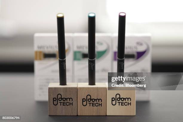 Japan Tobacco Inc.'s Ploom Tech smokeless tobacco devices sit on display during a media preview at the company's Ploom Shop Ginza in Tokyo, Japan, on...