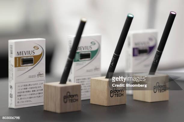 Japan Tobacco Inc.'s Ploom Tech smokeless tobacco devices sit on display during a media preview at the company's Ploom Shop Ginza in Tokyo, Japan, on...