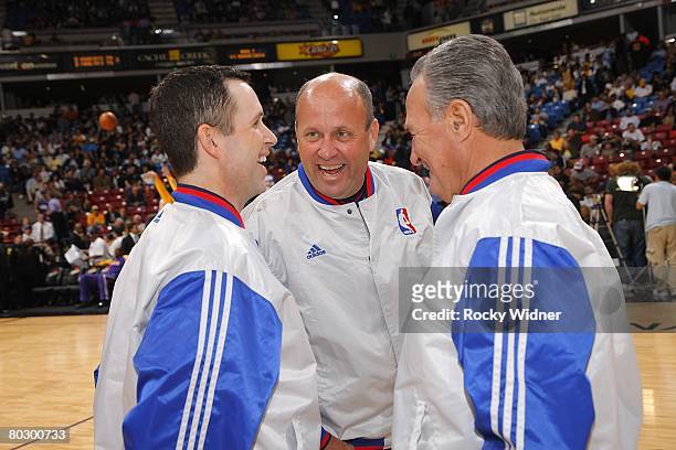 Officials Matt Boland, David Jones and Jack Nies smile as they talk during the NBA game of the Sacramento Kings against the Los Angeles Lakers on...