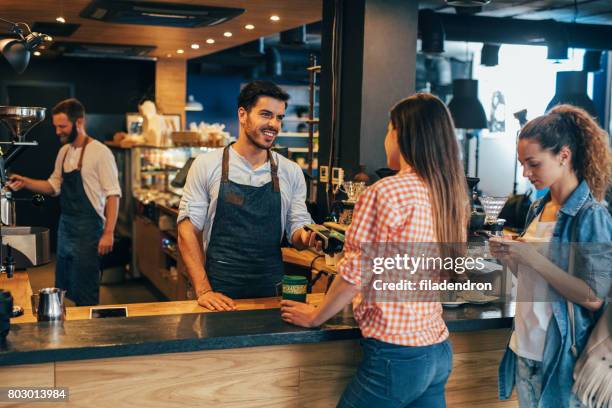 customer making a contactless payment - cafeteria counter stock pictures, royalty-free photos & images