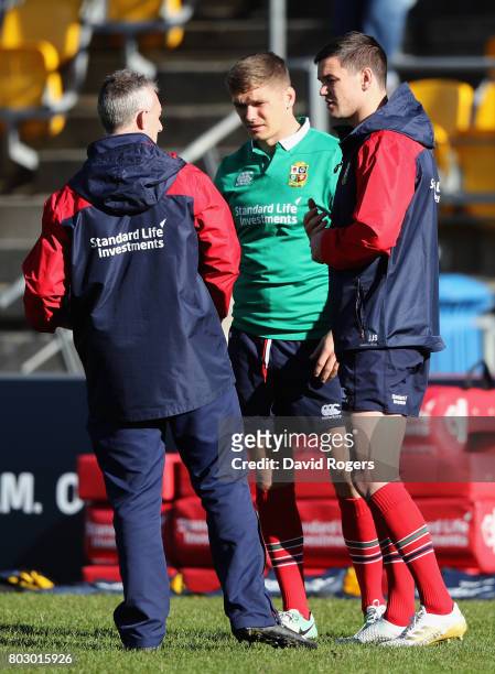 Rob Howley, the Lions backs coach talks to Owen Farrell and Jonathan Sexton during the British & Irish Lions training session at Porirua Park on June...
