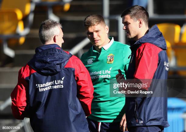 Rob Howley, the Lions backs coach talks to Owen Farrell and Jonathan Sexton during the British & Irish Lions training session at Porirua Park on June...