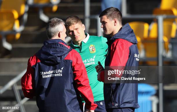 Rob Howley, the Lions backs coach talks to Owen Farrell and Jonathan Sexton during the British & Irish Lions training session at Porirua Park on June...