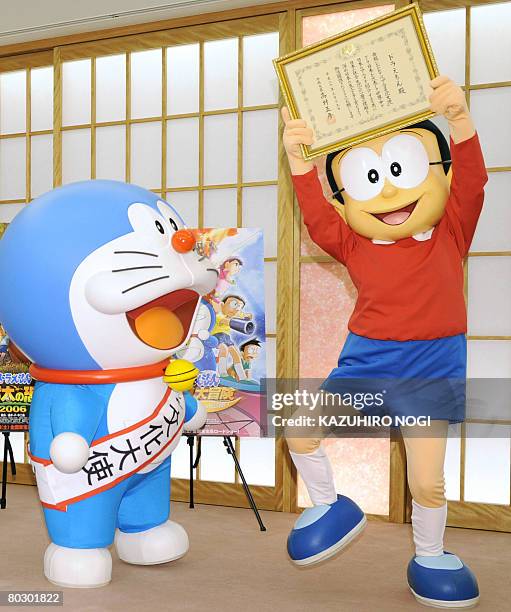 Japan's cartoon character Doraemon , who has been appointed as the nation's first Anime Ambassador, and his partner Nobita celebarte the appointment...