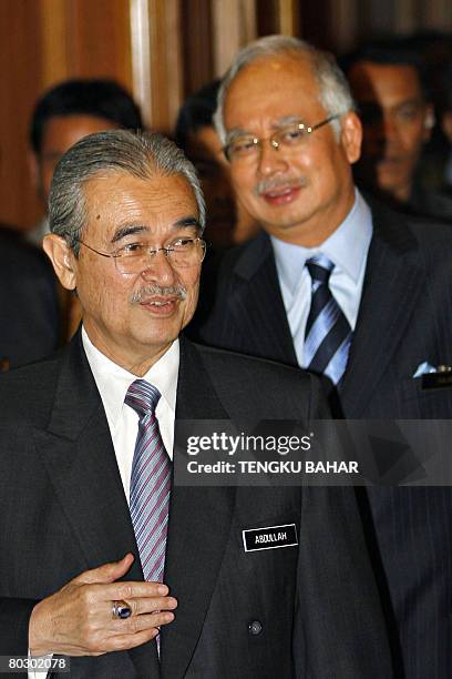 Malaysian Prime Minister Abdullah Ahmad Badawi and his deputy Najib Razak enter a hall for a press conference held after the new Malaysian cabinet...