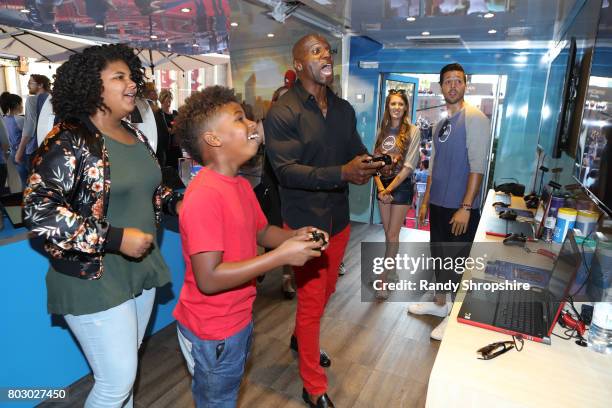 Wynfrey Crews, Isaiah Crews and actor Terry Crews at the Dell VR Experience at the "Spider-Man: Homecoming" World Premiere at TCL Chinese Theatre on...