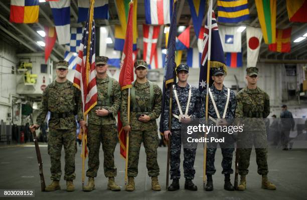 Flag party of U.S. Marines and Navy personnel take part in a ceremony marking the start of Talisman Saber 2017, a biennial joint military exercise...