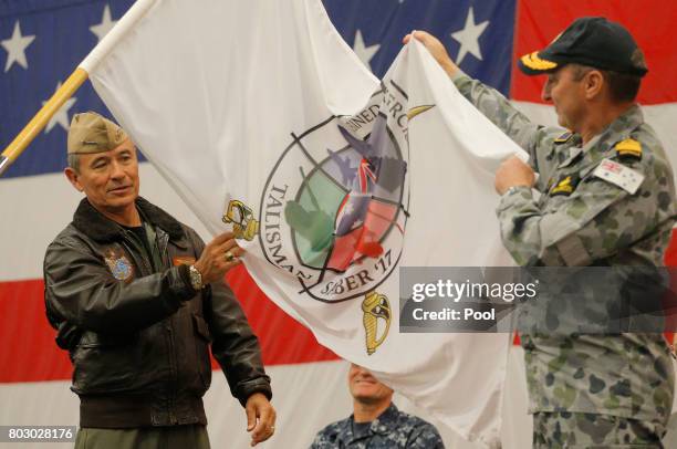 Navy Admiral Harry Harris, Commander of the U.S. Pacific Command and Australian Navy Vice Admiral David Johnston unfurl the Talisman Saber 2017 flag,...