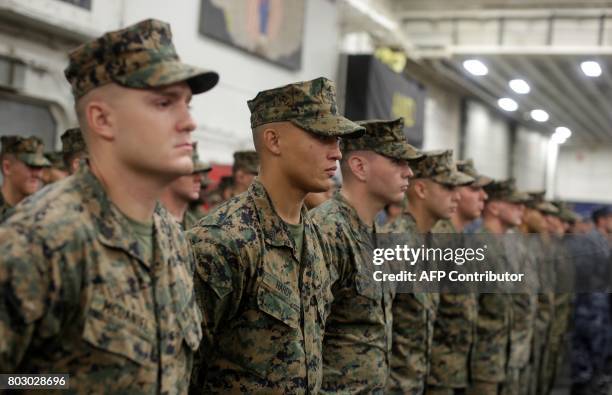 Marines stand aboard the USS Bonhomme Richard amphibious assault ship during a ceremony marking the start of Talisman Saber 2017, a biennial joint...