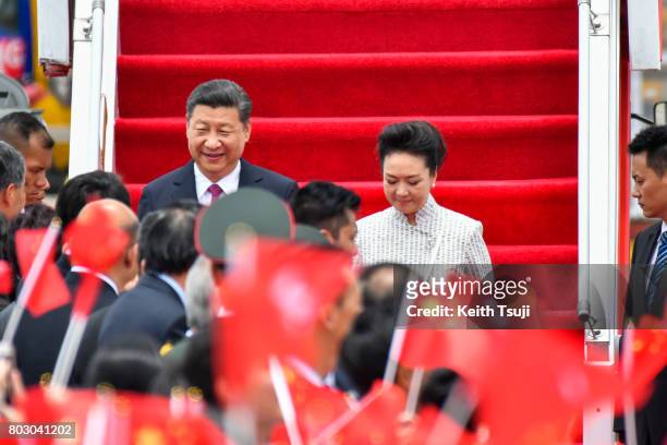 Chinese President Xi Jinping and first lady Peng Liyuan arrive at Hong Kong International Airport on June 29, 2017 in Hong Kong. Chinese President Xi...