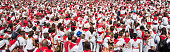 Crowd of people dressed in white and red at the Summer festival of Bayonne (Fetes de Bayonne), France