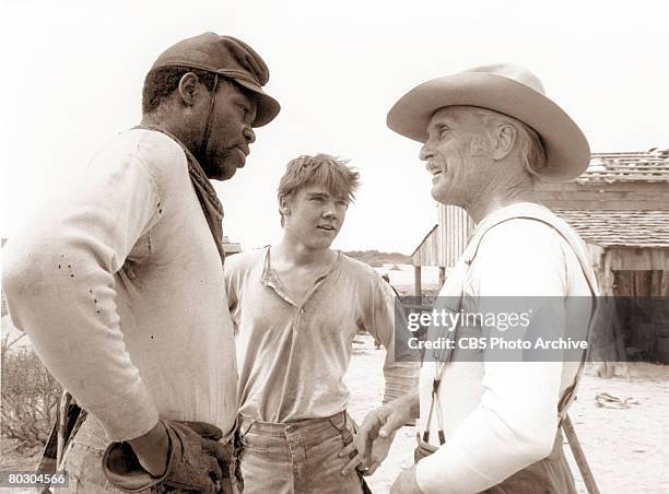 Promotional portrait of American actors Danny Glover , Rick Schroder , and Robert Duvall in the television mini-series 'Lonesome Dove,' directed by...