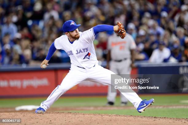 Toronto Blue Jays Pitcher Danny Barnes throws a pitch during the eighth inning of the MLB regular season game between the Toronto Blue Jays and the...