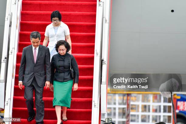 Chief Executive of Hong Kong Leung Chun Ying and his wife Regina Tong Ching-Yi at Hong Kong International Airport on June 29, 2017 in Hong Kong, Hong...