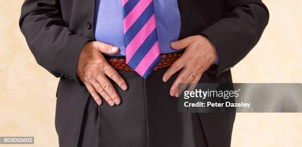 testicular cancer vasectomy - striped suit stock pictures, royalty-free photos & images
