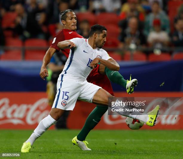 Bruno Alves of Portugal national team and Jean Beausejour of Chile national team vie for the ball during FIFA Confederations Cup Russia 2017...