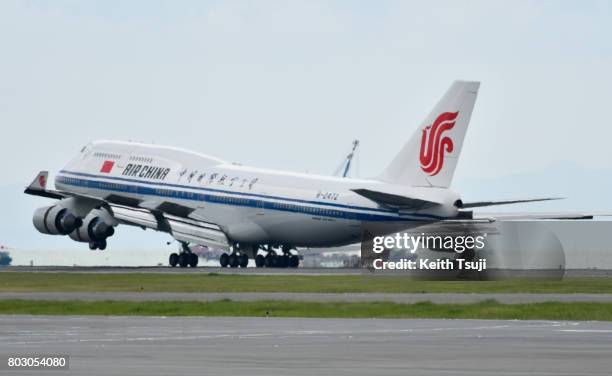 Boeing 747 of Air China carries Chinese President Xi Jinping and first lady Peng Liyuan land at hong Kong International Airport on June 29, 2017 in...