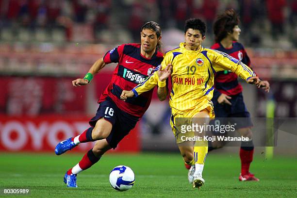 Marquinhos of Kashima Antlers and Nguyen Quang The of Dam Phu My Nam Dinh in action during AFC Champions League match between Kashima Antlers and Dam...