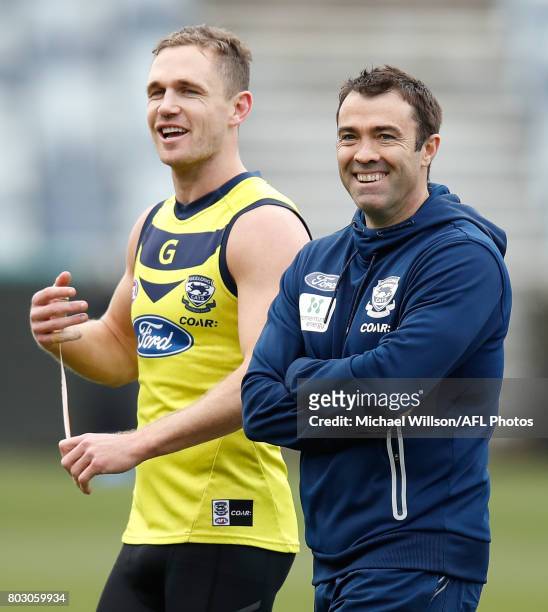 Joel Selwood and Chris Scott, Senior Coach of the Cats share a laugh during a Geelong Cats AFL training session at Simonds Stadium on June 29, 2017...