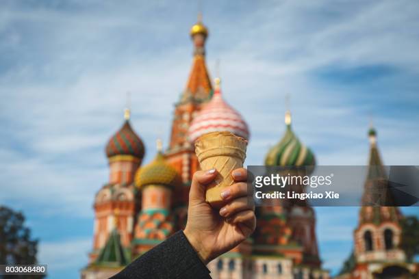 dome of st. basil's cathedral mimics a colorful ice cream cone, moscow, russia - st basil's cathedral stock pictures, royalty-free photos & images