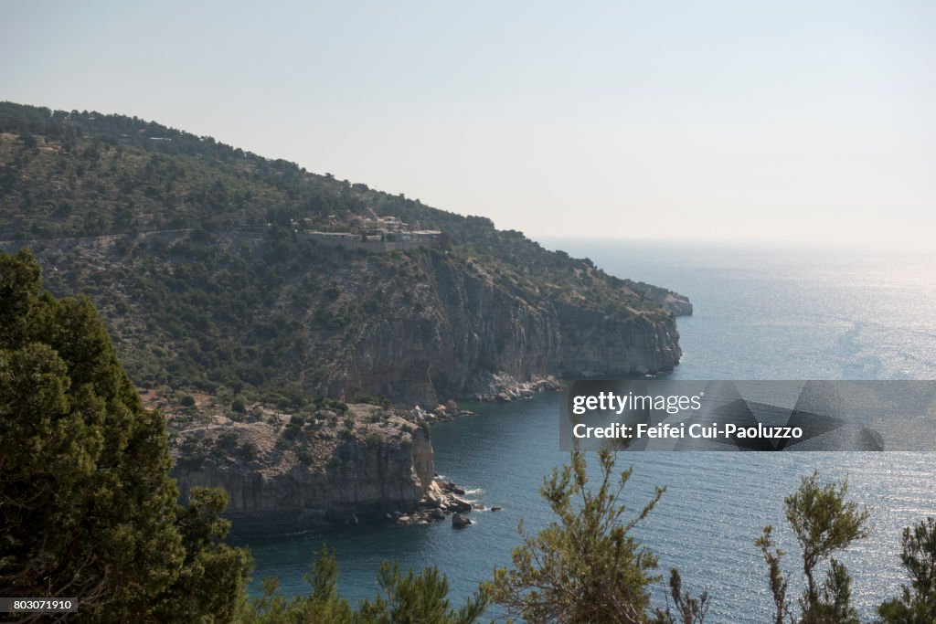 Rocky coastline and view on Monastery of Archangel Thasos, Kavala, East Macedonia and Thrace region, Northern Greece.