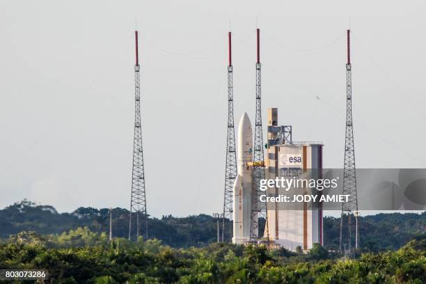 An Ariane 5 rocket lifts off on June 28, 2017 from the French Guiana Space Center in Kourou with HS3-IS satellite and India's latest communication...