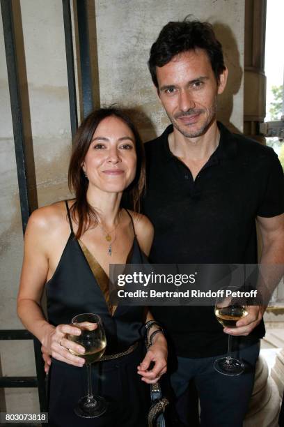 Singer Keren Ann and her companion Christian Camargo attend Artistic Director of Lanvin, Bouchra Jarrar is Decorated "Officier de l'Ordre des Arts et...