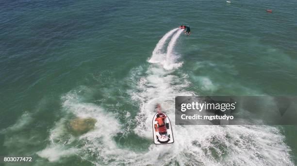 performance at flyboard - aerial stunts flying stock pictures, royalty-free photos & images