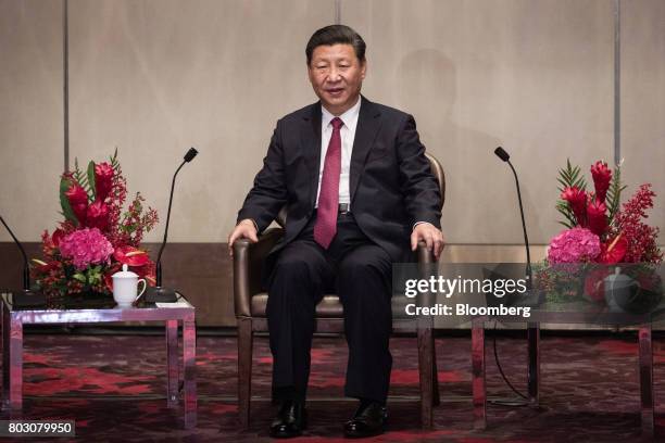 Xi Jinping, China's president, speaks during a meeting with Leung Chun-ying, Hong Kong's outgoing chief executive, not pictured, in Hong Kong, China,...