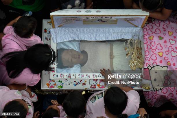 Relatives mourn over the coffin of sixteen year old Nercy Galicio, who according to police was raped and killed by unknown men after going missing...