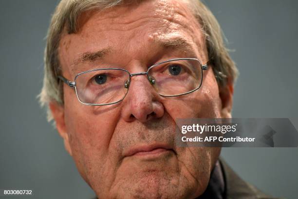 Australian Cardinal George Pell looks on as he makes a statement at the Holy See Press Office, Vatican city on June 29, 2017 after being charged with...