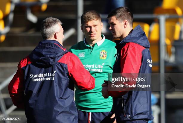 Rob Howley, the Lions backs coach talks to Owen Farrell and Jonathan Sexton during the British & Irish Lions training session at Porirua Park on June...